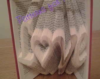 Book folding pattern for the word LOVE with a HEART