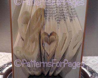 Book folding pattern for LOVE in a fancy font