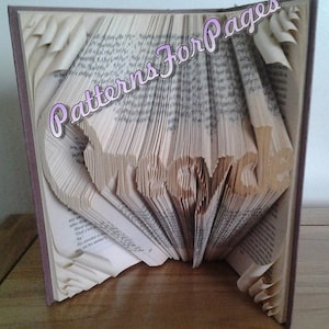 Book folding pattern for a RECYCLE logo