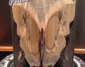 Book folding pattern for a BUTTERFLY