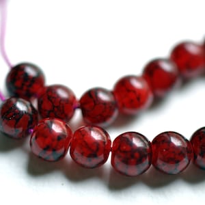 30 enamelled red acrylic  beads