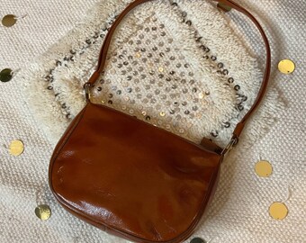 cognac patent purse