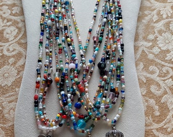 ETG75--Glass Mardi Gras beads from New Orleans with various Charms