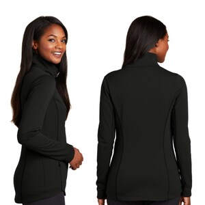 May include: A solid black long-sleeve jacket featuring a high collar, a full-length front zipper, and fitted side panels. The garment is shown from both a side-profile view and a rear view, highlighting the smooth fabric and tailored construction.