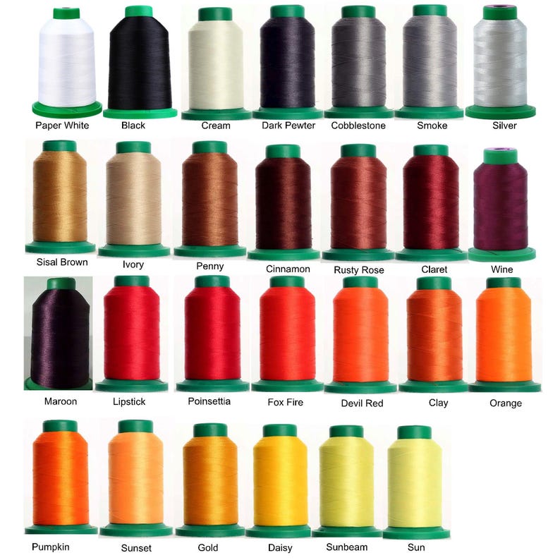 May include: A collection of twenty-seven cylindrical spools of embroidery thread arranged in four rows. Each spool features a green base and top cap, displaying a wide spectrum of colors including white, black, gray, brown, red, orange, and yellow.