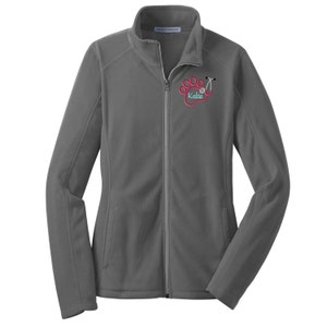 May include: A charcoal gray fleece jacket with a full-length front zipper and a high collar. The left chest features an embroidered design of a pink paw print integrated with a stethoscope, with the name Katte written in light blue script.
