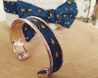 Brass bracelet and blue fabric