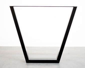 May include: Black metal table legs with a triangular shape. The legs are made of a sturdy metal and have a sleek, modern design.