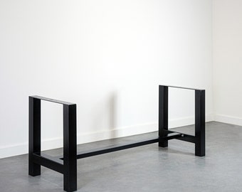 May include: Black metal table base with a rectangular top and four legs. The base is made of sturdy metal and has a simple, modern design.