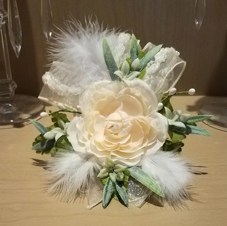 Lace Bridal Corsages With Beautiful Cream Colored Rose Greenery And A Shimmery Ribbon