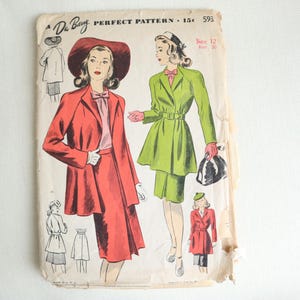 May include: Vintage sewing pattern for a two-piece dress with a jacket. The pattern is for size 12 and is from the De Berg Perfect Pattern line. The dress is green and the jacket is red.