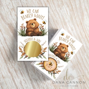 May include: Scratch-off game cards with a brown bear and bee illustration. The cards say "We can bearly wait!" and have a gold circle to scratch off.