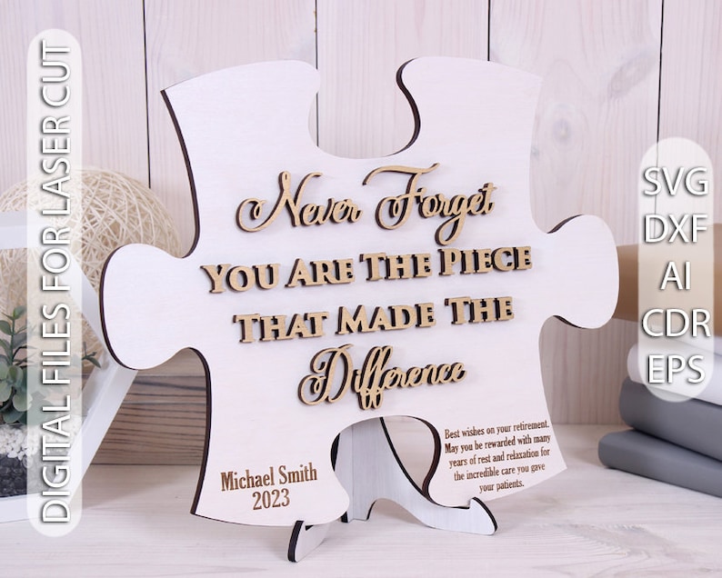 Peut inclure: Une pi&egrave;ce de puzzle en bois blanc avec le texte "Never Forget You Are The Piece That Made The Difference" en lettres brunes. La pi&egrave;ce de puzzle est pos&eacute;e sur un petit support en bois. Le texte "Michael Smith 2023" est grav&eacute; au bas de la pi&egrave;ce de puzzle. Le texte "Meilleurs v&oelig;ux pour votre retraite. Que vous soyez r&eacute;compens&eacute; par de nombreuses ann&eacute;es de repos et de d&eacute;tente pour les soins incroyables que vous avez prodigu&eacute;s &agrave; vos patients." est grav&eacute; sur le c&ocirc;t&eacute; de la pi&egrave;ce de puzzle.