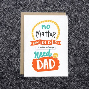 May include: A white greeting card with the text "no matter how old I get I will always need my DAD" in various colors. The card is inside a brown envelope, perfect for Father's Day or a birthday.