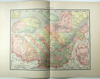 May include: A detailed vintage map of Quebec, Canada, featuring a variety of colours to denote different regions. The map includes geographical details and the word "QUEBEC" at the top. Printed on aged paper, the map is a historical document.