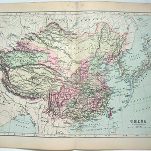 May include: Antique map of China, featuring detailed geographical information. The map uses a variety of colors to distinguish regions, with text labels for cities, bodies of water, and surrounding countries. The map is printed on aged paper.
