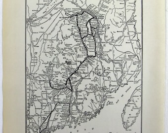 May include: A vintage black and white map of the Bangor & Aroostook Railroad and connections. The map shows the rail lines, towns, and geographical features of the region. The title "Bangor & Aroostook Railroad" is at the bottom.