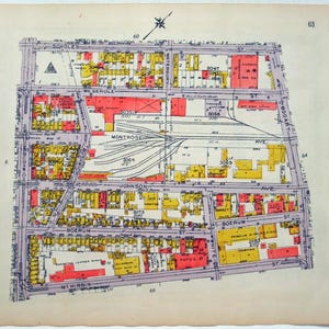 May include: A vintage map with streets and building outlines in red, yellow, and purple. Street names include Montrose Ave, Johnson Ave, and Boerum St. The map has a compass rose and numbers 60, 63, 64, and 66.