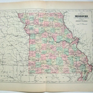 May include: A vintage map of Missouri, showing county boundaries and major cities. The map is printed in black and white with colored county borders. The map is titled "Map of Missouri" and includes the text "Drawn and Engraved for Johnson's Cyclopedia".