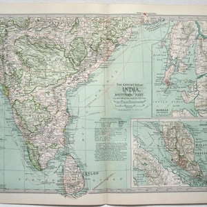 May include: Vintage map of Southern India from The Century Atlas. The map shows detailed geographical features, including cities, rivers, and mountains, with a focus on the southern part of India. Printed on aged paper, the map has a classic, vintage appearance.