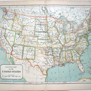 May include: A vintage political map of the United States, featuring detailed state boundaries and geographical features. The map has a light blue ocean and a scale of miles. The title "Political Map of the United States" is displayed in a rectangular box.