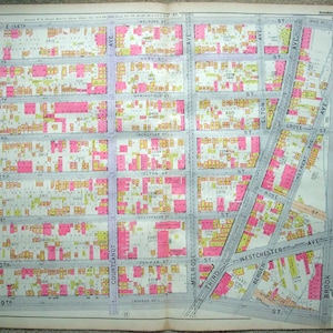 May include: A vintage map of a section of New York City, showing street names and building lots. The map is printed on a light blue background with black lines and text. The buildings are colored in pink and yellow.