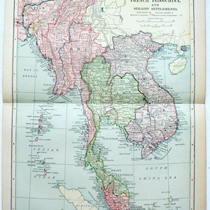 May include: A vintage map depicting Burma, Siam, French Indo-China, and Straits Settlements. The map shows geographical details with text labels and colour-coded regions, including the Bay of Bengal and the South China Sea.
