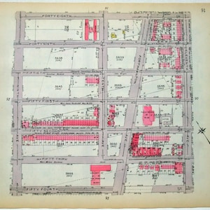 May include: A vintage map of New York City, showing the streets and buildings in the area around 52nd Street and 10th Avenue. The map is printed in black and white, with pink highlights indicating the locations of buildings.