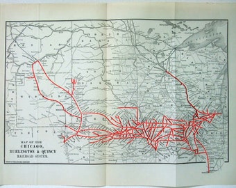 May include: A vintage map of the Chicago, Burlington & Quincy Railroad System. The map shows the railroad lines in red against a gray and white background. The map includes the states of Montana, North Dakota, South Dakota, Wyoming, Nebraska, and Minnesota.