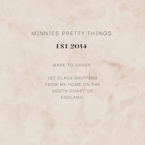 May include: A light beige marble-textured background featuring the black text: MINNIES PRETTY THINGS, EST.2014, MADE TO ORDER, 1ST CLASS SHIPPING FROM MY HOME ON THE SOUTH COAST OF ENGLAND. The design is centered with a clean, minimalist aesthetic.