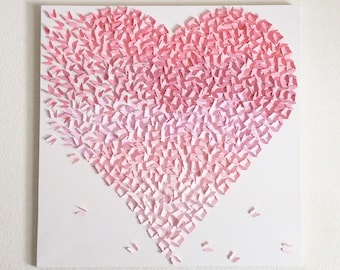 May include: A white canvas with a pink paper heart made of many small paper butterflies. The butterflies are arranged in a gradient pattern, with the darkest pink at the top and the lightest pink at the bottom.