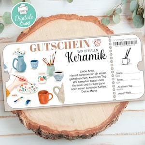 May include: A beige gift certificate with the text "GUTSCHEIN WIR BEMALEN Keramik" and illustrations of pottery and painting supplies. The certificate includes space for personalization and a barcode.
