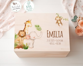 May include: A light-colored wooden box with a painted jungle animal theme. The box features a giraffe, lion, elephant, and monkey. The name "EMILIA" and birth details are printed on the box. The box is 48 cm long.