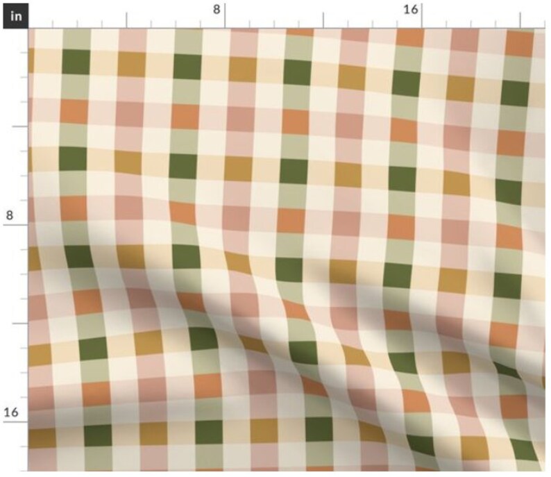May include: A cream-colored fabric with a checkered pattern in shades of green, pink, orange, and gold. The fabric is folded in the bottom right corner.