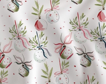 May include: A repeating pattern of watercolor Christmas ornaments on a white background. The ornaments are white with red polka dots and are decorated with green leaves, pink and blue ribbons, and red accents. The overall theme is festive and holiday-related.
