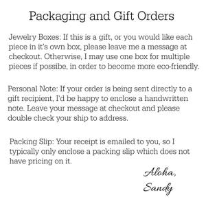 May include: Text explaining packaging and gift order options for jewelry. It includes information about jewelry boxes, personal notes, and packing slips. The text ends with "Aloha, Sandy".