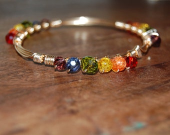 Wire wrapped beaded bracelet, gold with a rainbow of beads