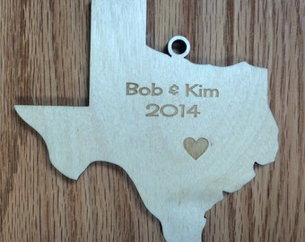 Texas Shaped Christmas Ornament with laser-etched year & names with heart over city