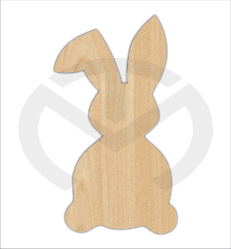 May include: A wooden cutout of a rabbit in a sitting position. The rabbit has long ears and a rounded body.