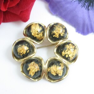 GOLD FLAKES on Black Lucite Petals Goldtone Flower PIN Vintage Brooch, Plastic  1 7/16&quot;