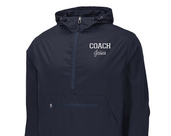 May include: A navy blue hooded windbreaker with a zipper closure and a kangaroo pocket. The jacket has the text "COACH Jessica" embroidered on the front.