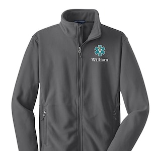 May include: A gray fleece jacket with a zipper closure. The jacket has a  star of life logo and the name "William" embroidered on the left chest.