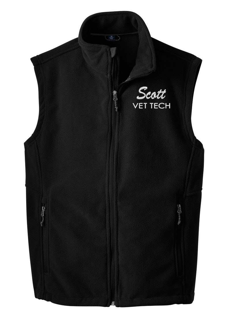May include: Black fleece vest with a zipper closure and two pockets. The vest has white embroidery that says "Scott VET TECH".