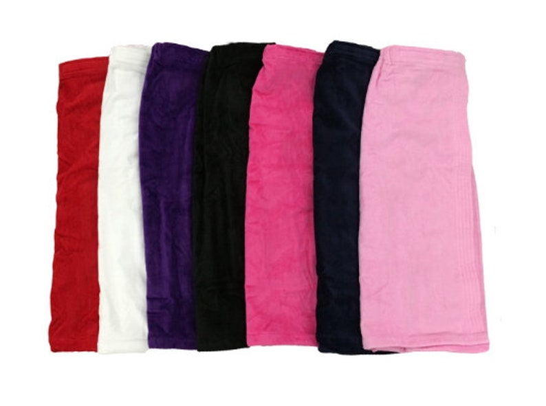 May include: Six plush bath wraps in different colors: red, white, purple, black, pink, and light pink. The wraps are made of soft, absorbent material and are perfect for drying off after a shower or bath.