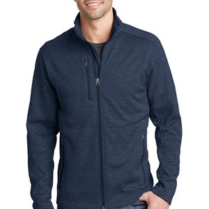 May include: A navy blue zip-up jacket with a textured pattern. The jacket has two zippered pockets on the front and a stand-up collar.