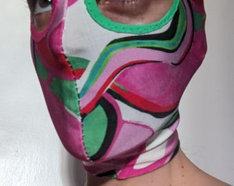 Psychedelic pink and green print fabric hood.