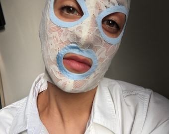 Sexy floral off white lace mask with baby blue contours.
