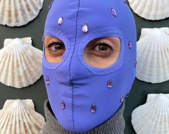 Lavender color fabric hood dotted with little teardrops purple pearls.