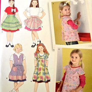 Patron de couture de tablier fille tabliers complets et tabliers à smocks à volants vichy et tabliers de travaux manuels taille enfant 3 4 5 6 7 8 non coupé Simplicité 4286