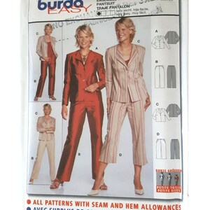 May include: A sewing pattern for a pantsuit, featuring illustrations of the finished garments in red, beige, and striped fabrics. The pattern includes sizes 6-23 and is labeled "Burda Easy" with the number 8375.